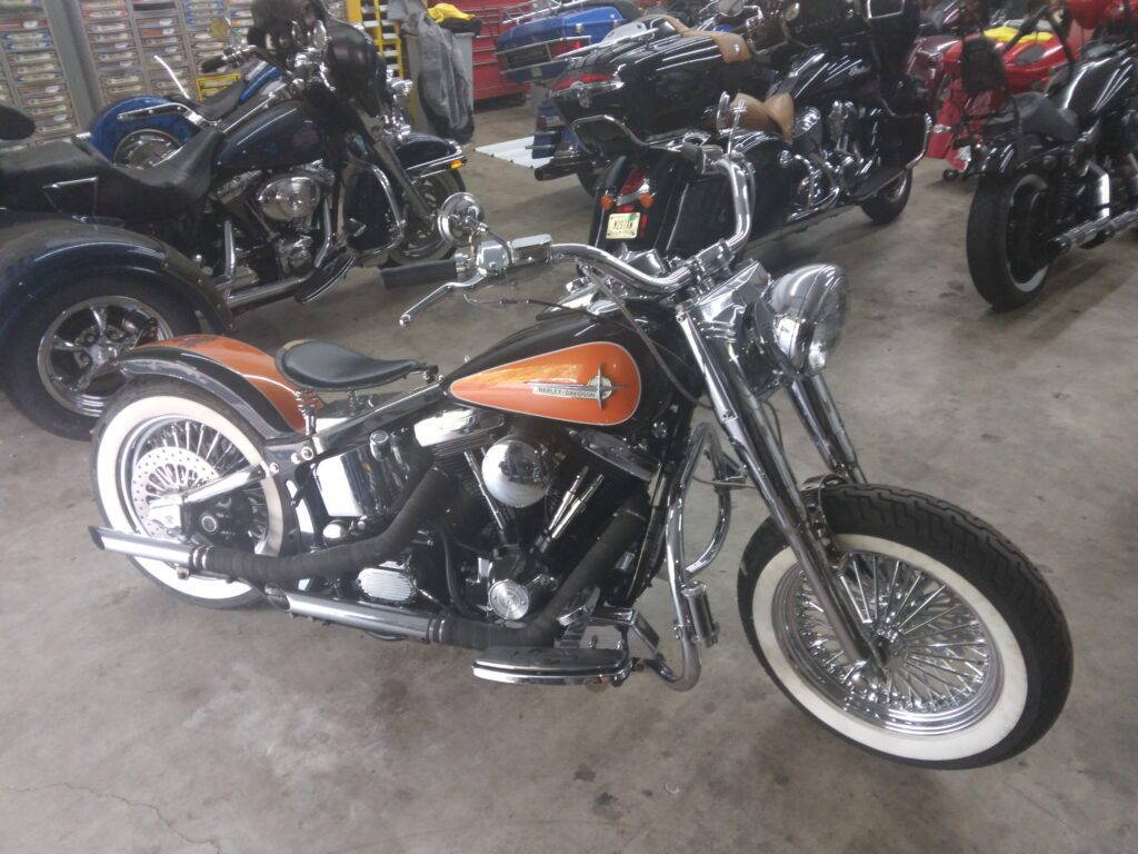 Orange and black bobber motorcycle