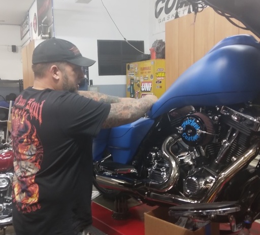 Chris repairing a Motorcycle